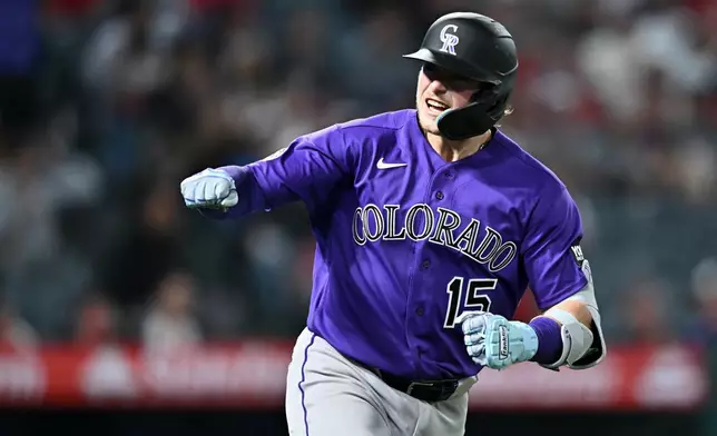 Colorado Rockies' Hunter Goodman reacts after hitting a home run during the eighth inning of a baseball game against the Los Angeles Angels, Monday, June 1, 2026, in Anaheim, Calif. (AP Photo/William Liang)