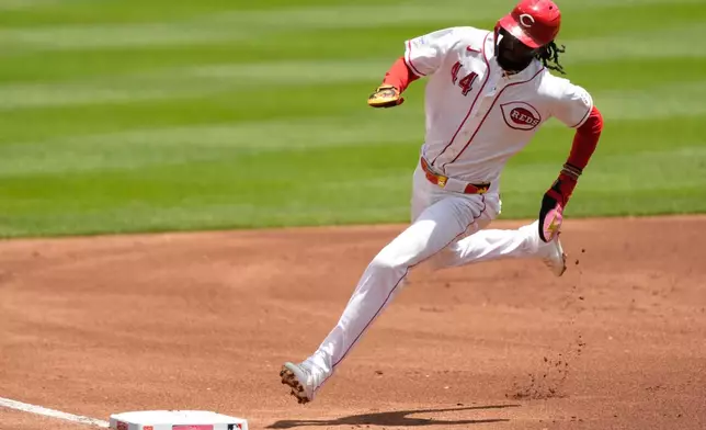 Cincinnati Reds' Elly de la Cruz rounds third base as he scores on a double hit by JJ Bleday during the first inning of a baseball game against the Atlanta Braves in Cincinnati, Sunday, May 31, 2026. (AP Photo/Carolyn Kaster)