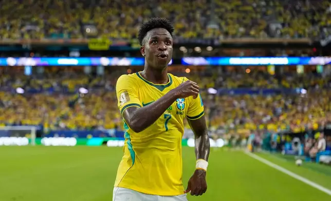 Brazil's Vinicius Junior (7) celebrates after scoring his side's second goal during the World Cup Group C soccer match between Scotland and Brazil in Miami Gardens, Fla., Wednesday, June 24, 2026. (AP Photo/Rebecca Blackwell)