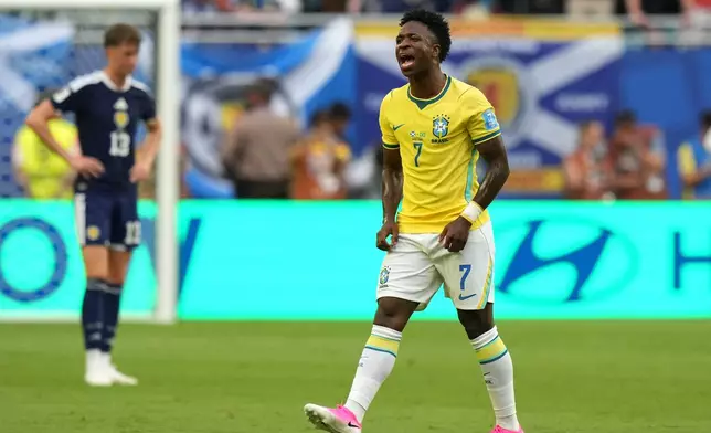 Brazil's Vinicius Junior (7) celebrates after scoring their opening goal during the World Cup Group C soccer match between Scotland and Brazil in Miami Gardens, Fla., Wednesday, June 24, 2026. (AP Photo/Lynne Sladky)