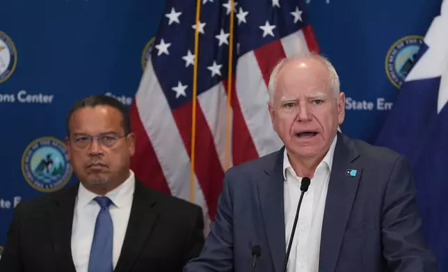 CORRECTS PRETTY TO PRETTI - Minnesota Gov. Tim Walz, right, and Attorney General Keith Ellison discuss the shooting of Alex Pretti during a news conference in Blaine, Minn., Sunday, Jan. 25, 2026. (AP Photo/Abbie Parr)