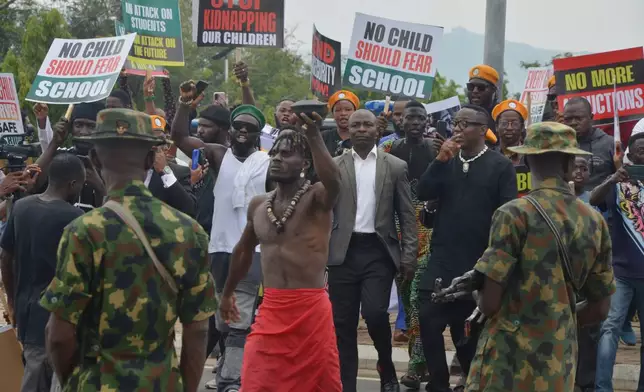 People protest demanding government to rescue the school children that were recently kidnapped in various part of the country, on the street of Abuja, Nigeria. Thursday, June 4, 2026. (AP Photo/Olamikan Gbemiga)