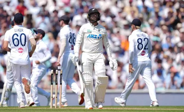New Zealand's Devon Conway leaves the field after being dismissed on day three of the second cricket test between England and New Zealand, in London, Friday June 19, 2026. (Ben Whitley/PA via AP)