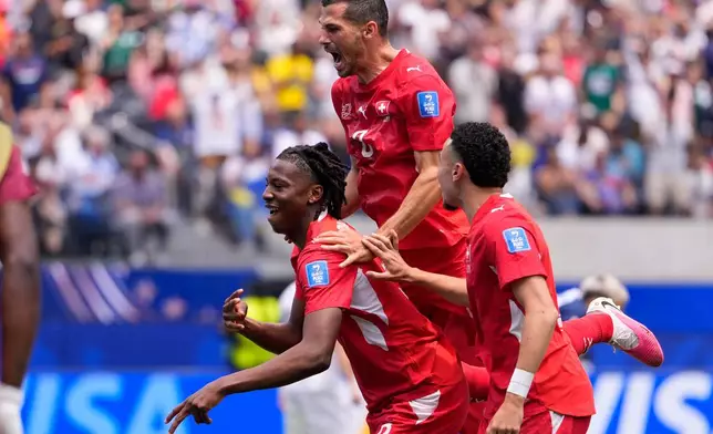Switzerland's Johan Manzambi, left, celebrates with teammates after scoring the opening goal against Bosnia during the World Cup Group B soccer match in Inglewood, Calif., near Los Angeles, Thursday, June 18, 2026. (AP Photo/Mark J. Terrill)