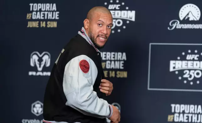 UFC heavyweight fighter Cyril Gane of Franceshows a patch on the sleeve of his jacket during the UFC Freedom 250 media day, Wednesday, June 10, 2026, in Washington. (AP Photo/Manuel Balce Ceneta)