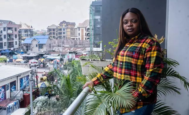 Gloria Masanka, a mother of two daughters, poses for a photo at her home in Kinshasa, Congo, Monday, April 6, 2026. (AP Photo/Samy Ntumba Shambuyi)