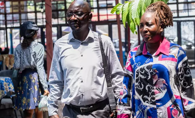 Prosper Mbumba poses with his wife, Regine Ntumba, the mother of their six children (four daughters and two sons) in Kinshasa, Congo, Monday, April 6, 2026. (AP Photo/Samy Ntumba Shambuyi)