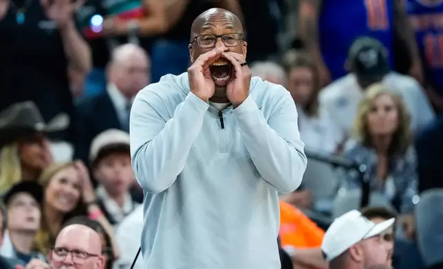 New York Knicks head coach Mike Brown yells during the first half of Game 5 of the NBA Finals basketball series against the San Antonio Spurs, Saturday, June 13, 2026, in San Antonio. (AP Photo/Ross D. Franklin)