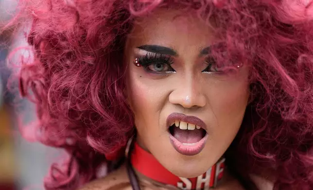 A performer dances during a Pride rally in Manila, Philippines on Friday, June 26, 2026. (AP Photo/Aaron Favila)