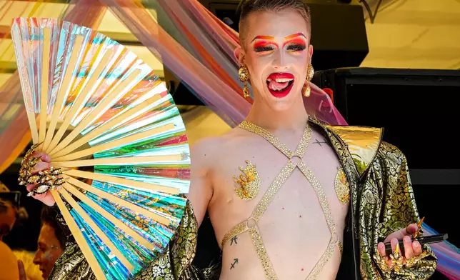 A person dances during the Zurich Pride parade in Zurich, Switzerland, Saturday, June 20, 2026. (AP Photo/Vadim Ghirda)