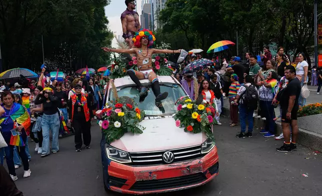 Participants take part in the annual Pride Parade in Mexico City, Saturday, June 26, 2026. (AP Photo/Marco Ugarte)