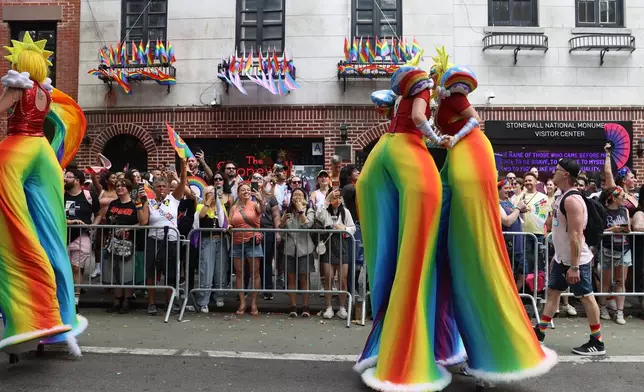 Parade-goers attend the NYC Pride March near the Stonewall Inn, Sunday, June 28, 2026 in New York. (AP Photo/Pamela Smith)