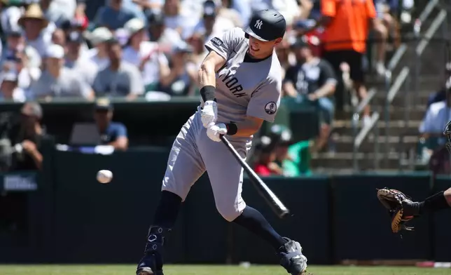 New York Yankees' Ben Rice hits an two-RBI triple during the third inning of a baseball game against the Athletics, Sunday, May 31, 2026, in West Sacramento, Calif. (AP Photo/Scott Marshall)