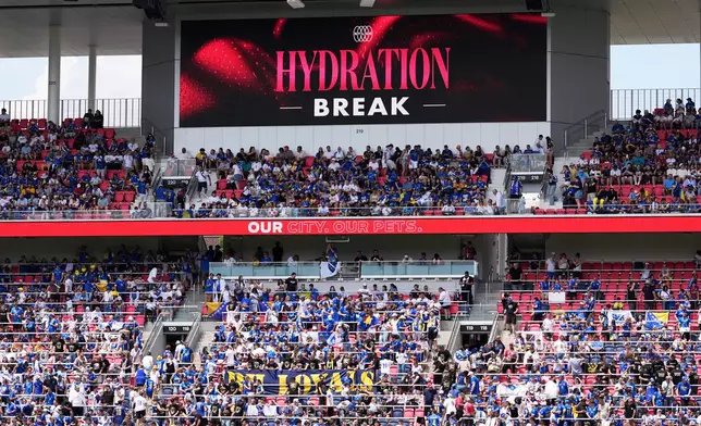 A screen announces a hydration break for players due to hot temperatures during the first half of an international friendly soccer match between Bosnia and Panama Saturday, June 6, 2026, in St. Louis. (AP Photo/Jeff Roberson)