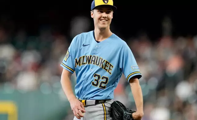 Milwaukee Brewers starting pitcher Jacob Misiorowski smiles after having a called strike overturned by a Houston Astros' ABS challenge during the first inning of a baseball game, Sunday, May 31, 2026, in Houston. (AP Photo/Eric Christian Smith)