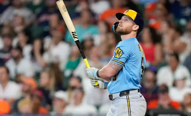 Milwaukee Brewers' Jake Bauers watches his two-run home run against the Houston Astros during the fourth inning of a baseball game, Sunday, May 31, 2026, in Houston. (AP Photo/Eric Christian Smith)