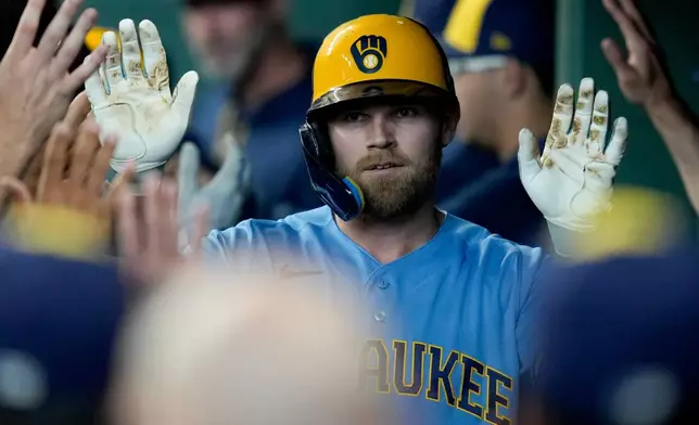 Milwaukee Brewers' Jake Bauers celebrates after his two-run home run against the Houston Astros during the fourth inning of a baseball game, Sunday, May 31, 2026, in Houston. (AP Photo/Eric Christian Smith)