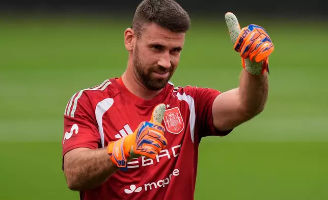 Spain goalkeeper Unai Simon reacts to fans during a training session, Saturday, June 6, 2026, in Chattanooga, Tenn., ahead of the World Cup soccer tournament. (AP Photo/Mike Stewart)