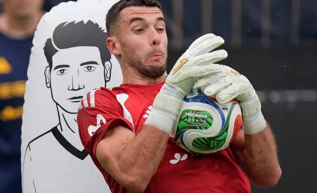 Spain goalkeeper Joan Garcia works out during a training session, Saturday, June 6, 2026, in Chattanooga, Tenn., ahead of the World Cup soccer tournament. (AP Photo/Mike Stewart)