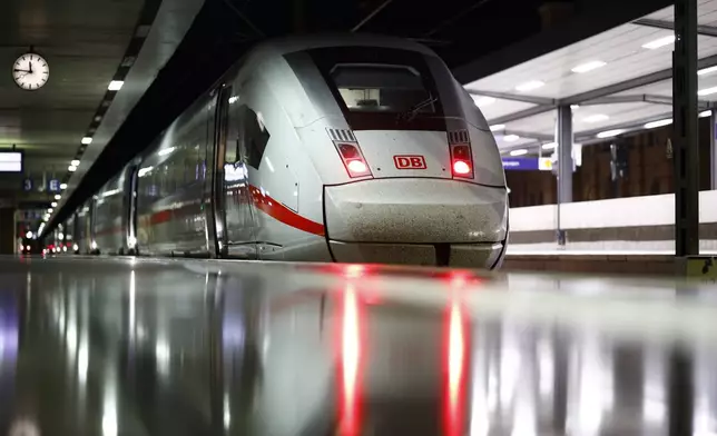 A train is parked on a platform at Hannover Central Station, Tuesday, June 23, 2026. (Moritz Frankenberg/dpa via AP)