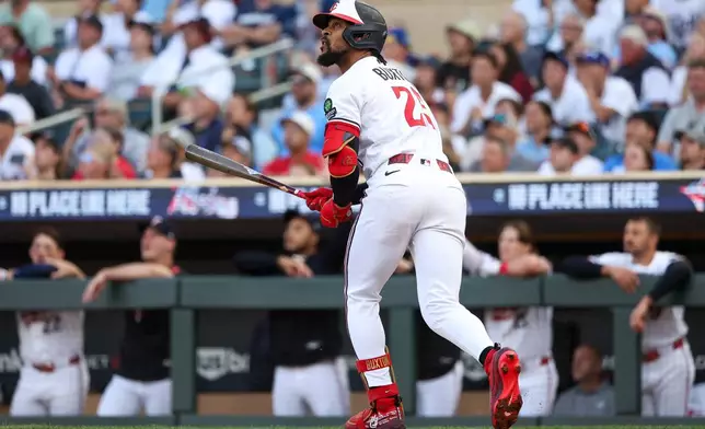 Minnesota Twins' Byron Buxton watches his solo home run against the Los Angeles Dodgers during the first inning of a baseball game, Monday, June 22, 2026, in Minneapolis. (AP Photo/Matt Krohn)