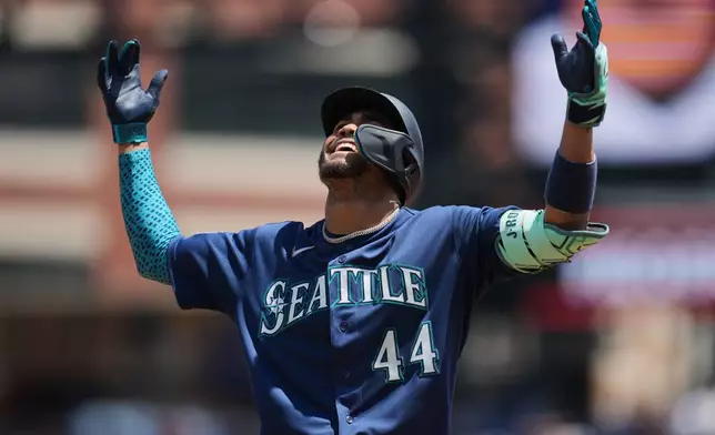 Seattle Mariners' Julio Rodríguez reacts to hitting a single against the Detroit Tigers during the third inning of a baseball game Saturday, June 6, 2026, in Detroit. (AP Photo/Paul Sancya)
