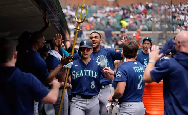 Seattle Mariners' Dominic Canzone (8) celebrates his home run against the Detroit Tigers during the third inning of a baseball game Saturday, June 6, 2026, in Detroit. (AP Photo/Paul Sancya)
