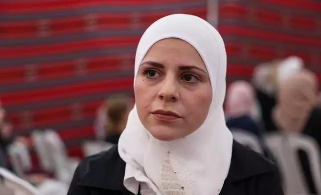 Doa'a al-Abbasi, cousin of former chess champion Rania al-Abbasi, attends a gathering to mourn al-Abbasi and her family, who disappeared 13 years ago, after relatives announced Monday they had evidence the family was killed by pro-government gunmen in 2013, in Damascus, Syria, Tuesday, June 2, 2026. (AP Photo/Ghaith Alsayed)