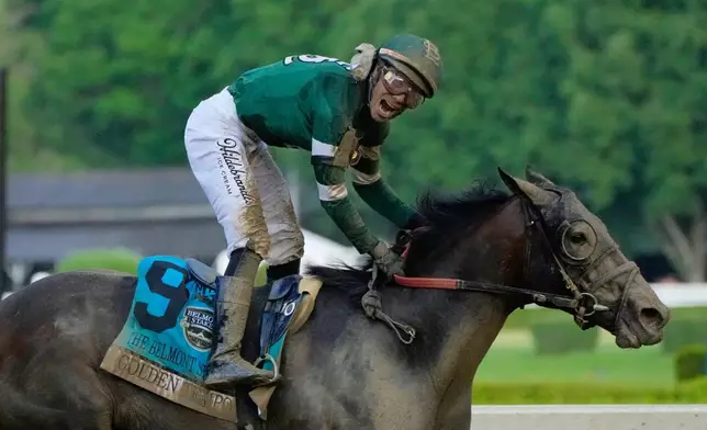Jockey Jose Ortiz celebrates as he crosses the finish line aboard Golden Tempo (9) to win the 158th running of the Belmont Stakes horse race, Saturday, June 6, 2026, in Saratoga Springs, N.Y. (AP Photo/Yuki Iwamura)