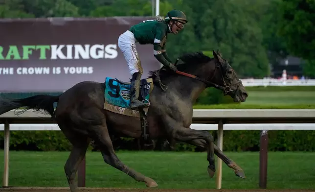 Golden Tempo (9) with Jockey Jose Ortiz crosses the finish line to win the 158th running of the Belmont Stakes horse race, Saturday, June 6, 2026, in Saratoga Springs, N.Y. (AP Photo/Yuki Iwamura)