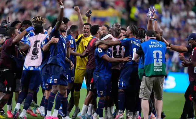 Cape Verde team members celebrate after the World Cup Group H soccer match between Cape Verde and Saudi Arabia in Houston, Friday, June 26, 2026. (AP Photo/Ashley Landis)