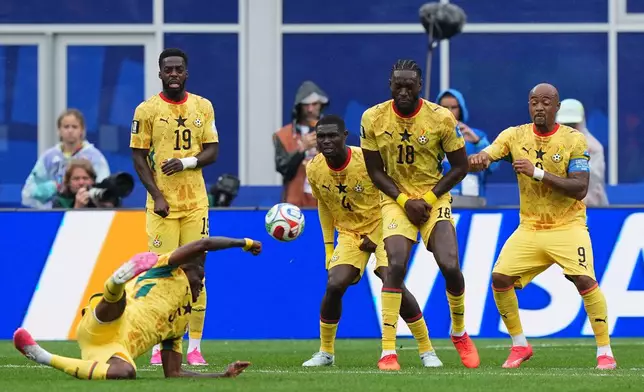 Ghana's Thomas Partey (5), left, kicks the ball during the World Cup Group L soccer match between England and Ghana in Foxborough, Mass., near Boston, Tuesday, June 23, 2026. (AP Photo/Martin Meissner)