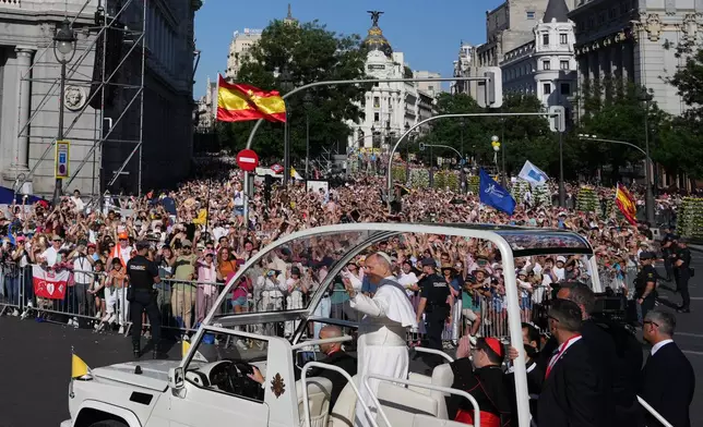 Pope Leo XIV arrives to preside over Mass marking the Catholic feast of Corpus Christi in Plaza de Cibeles in Madrid, Sunday, June 7, 2026, on the second day of a seven-day apostolic journey to mainland Spain and the Canary Islands. (AP Photo/Alessandra Tarantino)