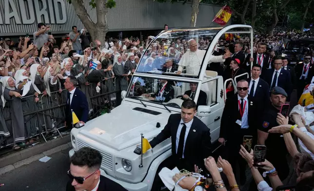 Pope Leo XIV arrives in the popemobile at Plaza de Lima in Madrid, Saturday, June 6, 2026, for a prayer vigil with young people on the first day of a seven-day apostolic journey to mainland Spain and the Canary Islands. (AP Photo/Bernat Armangue)