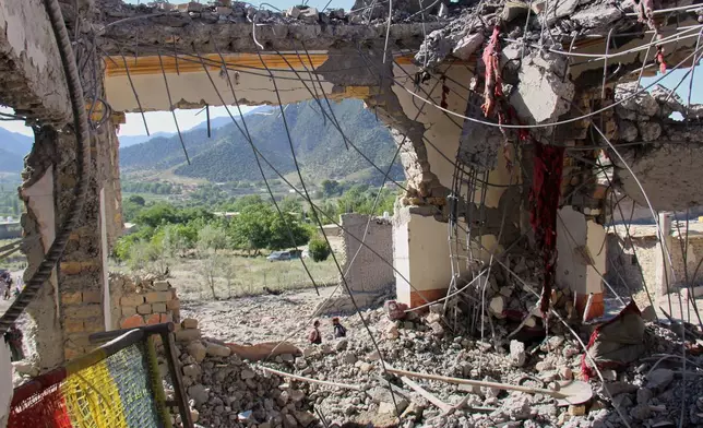 The remains of a destroyed house are seen after what Taliban officials said were Pakistani airstrikes a day earlier that killed civilians, including children, in the village of Mandokhail, Chamkani district, Paktia province, Afghanistan, Monday, June 29, 2026. (AP Photo/Saifullah Zahir)