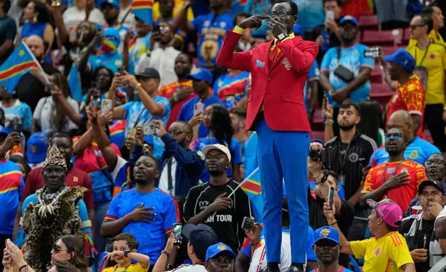 Congo supporter Michel Nkuka Mboladinga, poses dressed as the country's assassinated independence hero Patrice Lumumba, reacts ahead of the World Cup Group K soccer match between Colombia and Congo in Zapopan, near Guadalajara, Mexico, Tuesday, June 23, 2026. (AP Photo/Natacha Pisarenko)