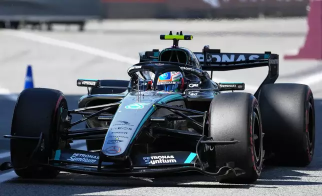 Mercedes driver George Russell of Britain returns to the pits after session for the Spain F1 Grand Prix at the Barcelona Catalunya racetrack in Montmelo, near Barcelona, Spain, Saturday, June 13, 2026. (Manaure Quintero/Pool Photo via AP)