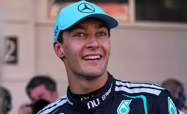 Mercedes driver George Russell of Britain celebrates his pole position after qualifying session for the Spain F1 Grand Prix at the Barcelona Catalunya racetrack in Montmelo, near Barcelona, Spain, Saturday, June 13, 2026. (AP Photo/Fatima Shbair)