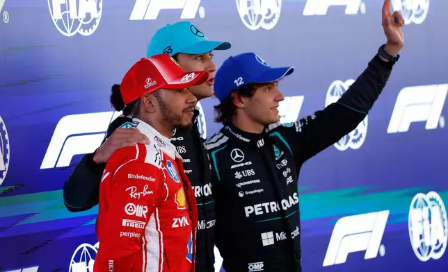 From left: Ferrari driver Lewis Hamilton of Britain, Mercedes driver George Russell of Britain, and Mercedes driver Andrea Kimi Antonelli of Italy celebrate after qualifying session for the Spain F1 Grand Prix at the Barcelona Catalunya racetrack in Montmelo, near Barcelona, Spain, Saturday, June 13, 2026. (AP Photo/Joan Monfort)