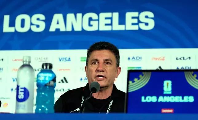 Iran head coach Amir Ghalehnoy speaks during a press conference ahead of his FIFA World Cup match against New Zealand in Inglewood, Calif., near Los Angeles, Sunday, June 14, 2026. (AP Photo/Andre Penner)