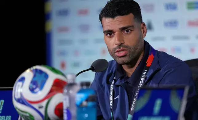Iran's Mehdi Taremi speaks during a press conference ahead of his FIFA World Cup match against New Zealand in Inglewood, Calif., near Los Angeles, Sunday, June 14, 2026. (AP Photo/Andre Penner)