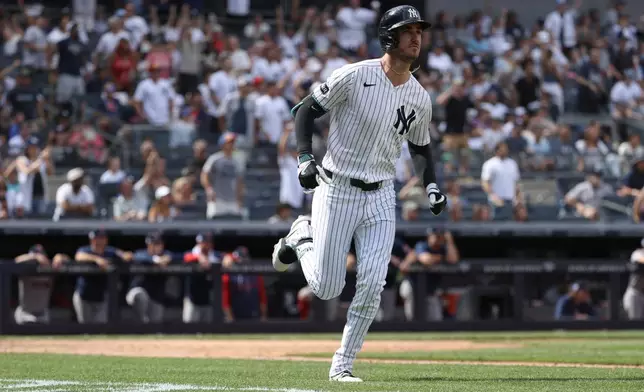 New York Yankees' Cody Bellinger runs after hitting a home run during the eighth inning of a baseball game against the Boston Red Sox, Sunday, June 7, 2026, in New York. (AP Photo/Pamela Smith)