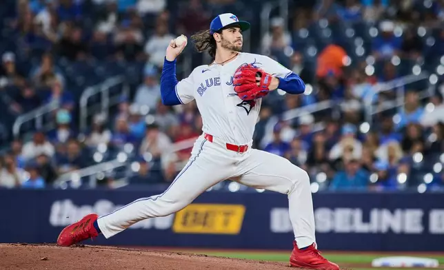 Toronto Blue Jays' Dylan Cease works against the Philadelphia Phillies during the first inning of a baseball game in Toronto, Tuesday, June 9, 2026. (Sammy Kogan/The Canadian Press via AP)