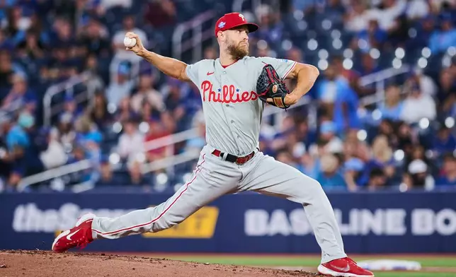 Philadelphia Phillies' Zack Wheeler works against the Toronto Blue Jays during the first inning of a baseball game in Toronto, Tuesday, June 9, 2026. (Sammy Kogan/The Canadian Press via AP)