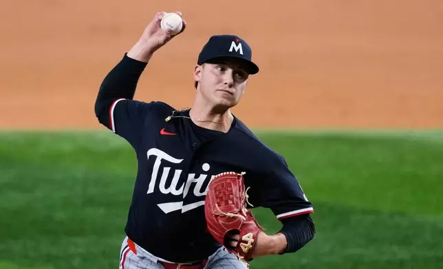 Minnesota Twins pitcher Mike Paredes throws to the Texas Rangers in the second inning of a baseball game in Arlington, Texas, Monday, June 15, 2026. (AP Photo/Tony Gutierrez)