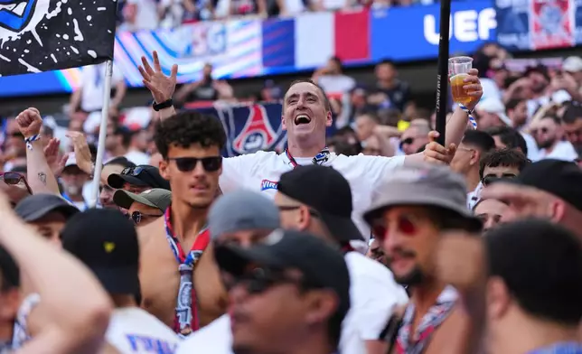 FILE - PSG fans cheer for their team before the Champions League final soccer match between Paris Saint-Germain and Arsenal in Budapest, Hungary, May 30, 2026. (AP Photo/Andreea Alexandru, File)