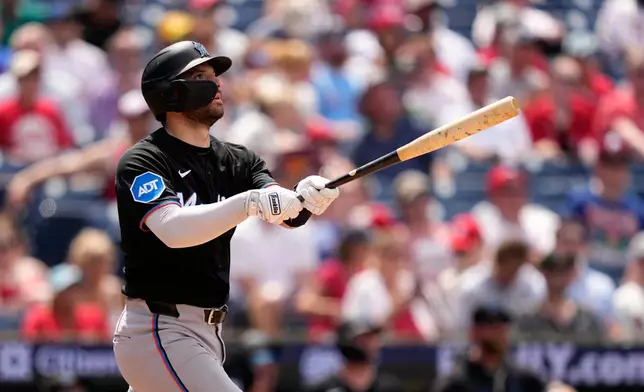 Miami Marlins' Joe Mack follows through after hitting a two-run home run against Philadelphia Phillies pitcher Tanner Banks during the sixth inning of a baseball game Wednesday, June 17, 2026, in Philadelphia. (AP Photo/Matt Slocum)