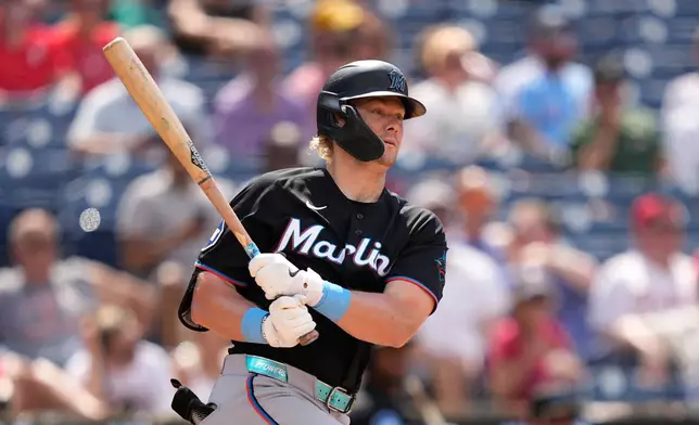 Miami Marlins' Kyle Stowers follows through after hitting a run-scoring single against Philadelphia Phillies pitcher Orion Kerkering during the eighth inning of a baseball game Wednesday, June 17, 2026, in Philadelphia. (AP Photo/Matt Slocum)