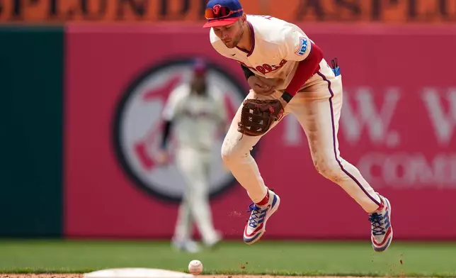 Philadelphia Phillies shortstop Trea Turner fields a gounder by Miami Marlins' Jakob Marsee during the sixth inning of a baseball game Wednesday, June 17, 2026, in Philadelphia. (AP Photo/Matt Slocum)