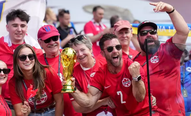 Canadian fans cheer before the World Cup Group B soccer match between Canada and Bosnia, Friday, June 12, 2026, in Toronto. (Nathan Denette/The Canadian Press via AP)